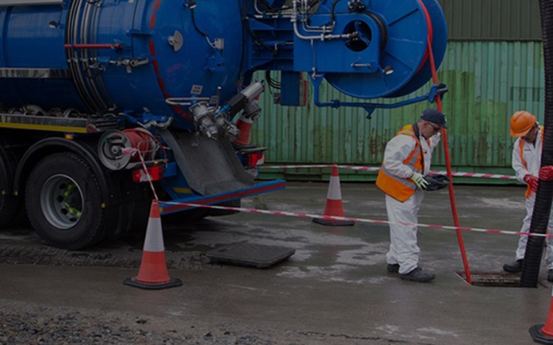 a people maintaining manhole management