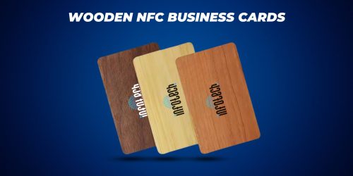 Wooden NFC business cards in three different wood finishes—dark, light, and medium tones—featuring the Infotech logo, displayed on a blue background